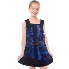 Illuminated Cityscape Against Blue Sky At Night Kids  Cross Back Dress by Modalart